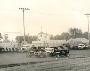 Leo Christensen, 8, Darrell Dawley, 25, Gale White, 7X, and Bobby Geldner get together at the Clay County Fair, Spencer, IA. White collection. 