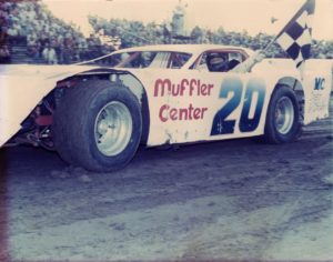 Holding the checkers after a late model victory. (Anderson collection)